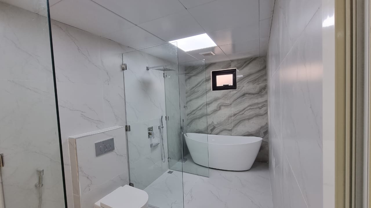 Marble bathroom with freestanding tub, Al Rahba