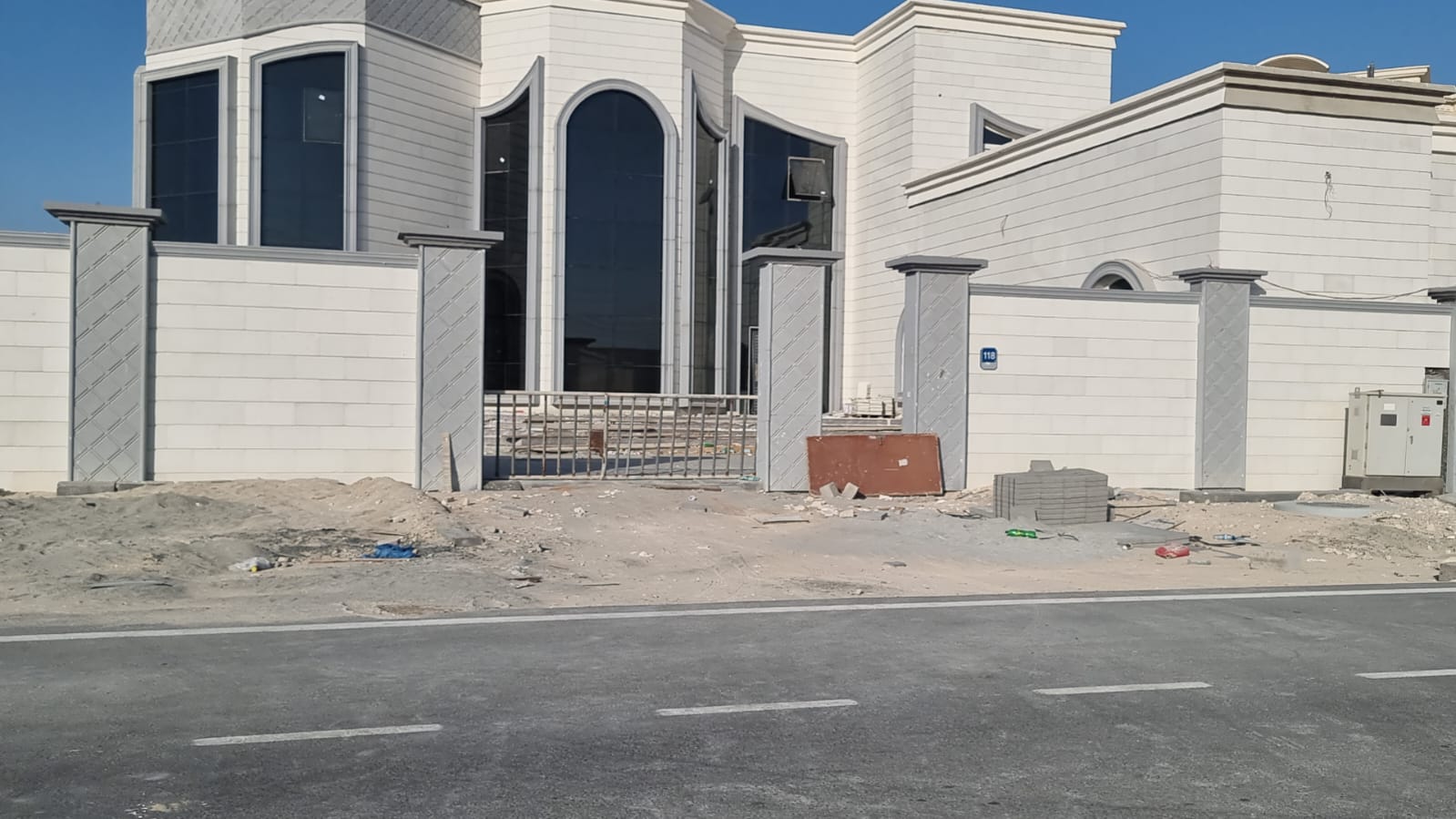 Modern villa with curved glazing in Taweela.